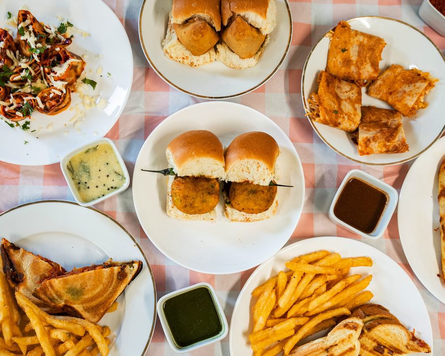 A spread of authentic Mumbai street food – vada pav, pav bhaji, dosa and chaat – from Preeti's in Vancouver